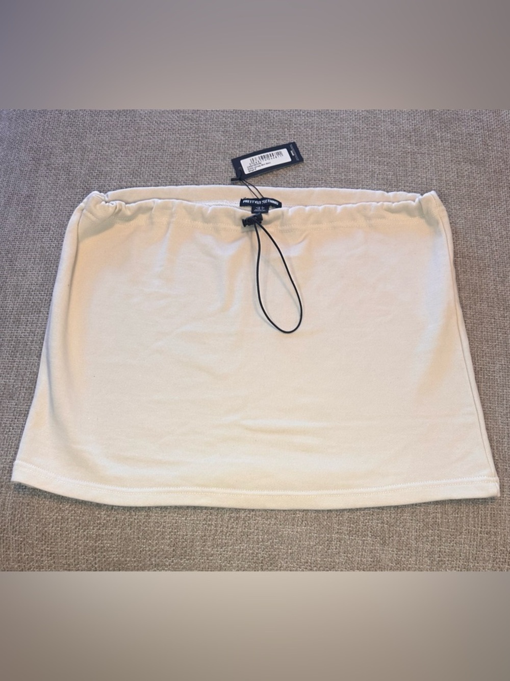 PrettyLittleThing Cream Mini Skirt
